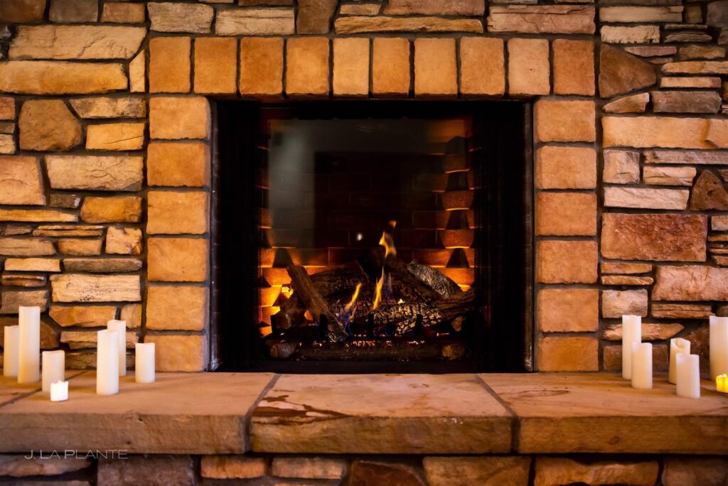 Beautiful Colorado stone fireplace at The Lodge at Cathedral Pines event venue