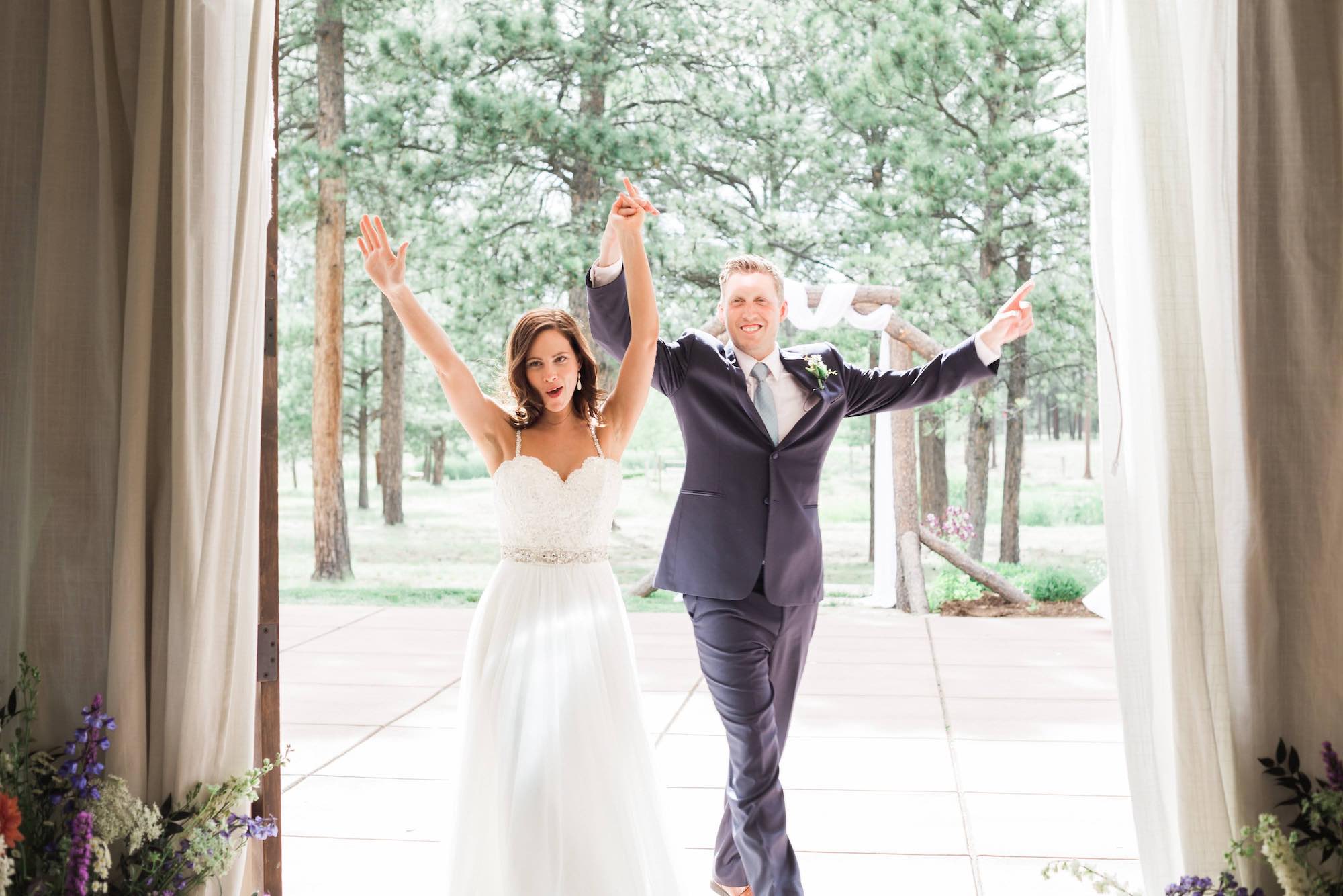 Couple walks into The Lodge at Cathedral Pines after being married