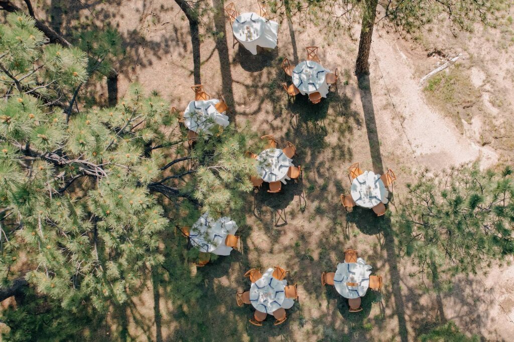 Tables set up outdoors for a party at The Lodge at Cathedral Pines in Colorado Springs
