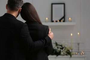 Couple mourning while deciding on having a Celebration of Life vs Funeral