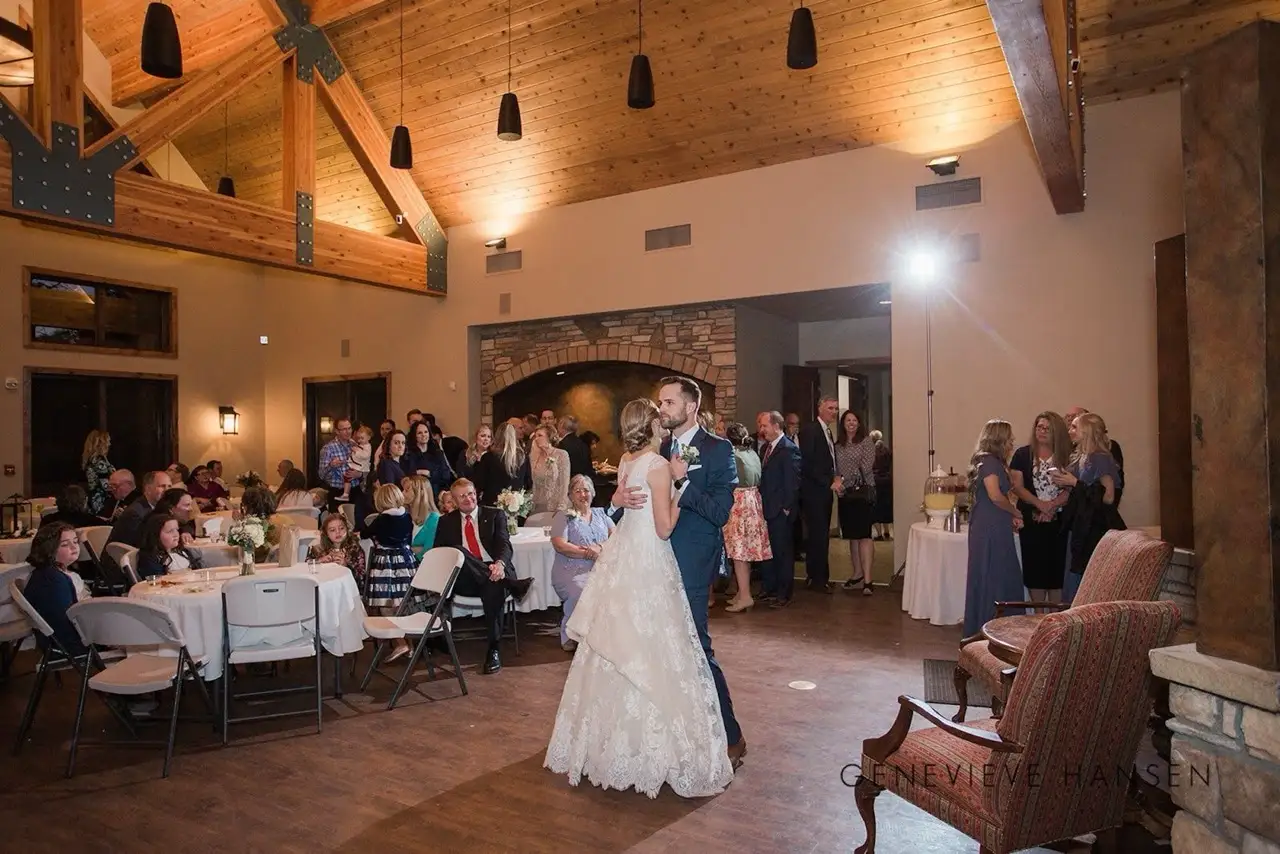 Bride and groom dancing at a beautiful wedding reception at The Lodge at Cathedral Pines